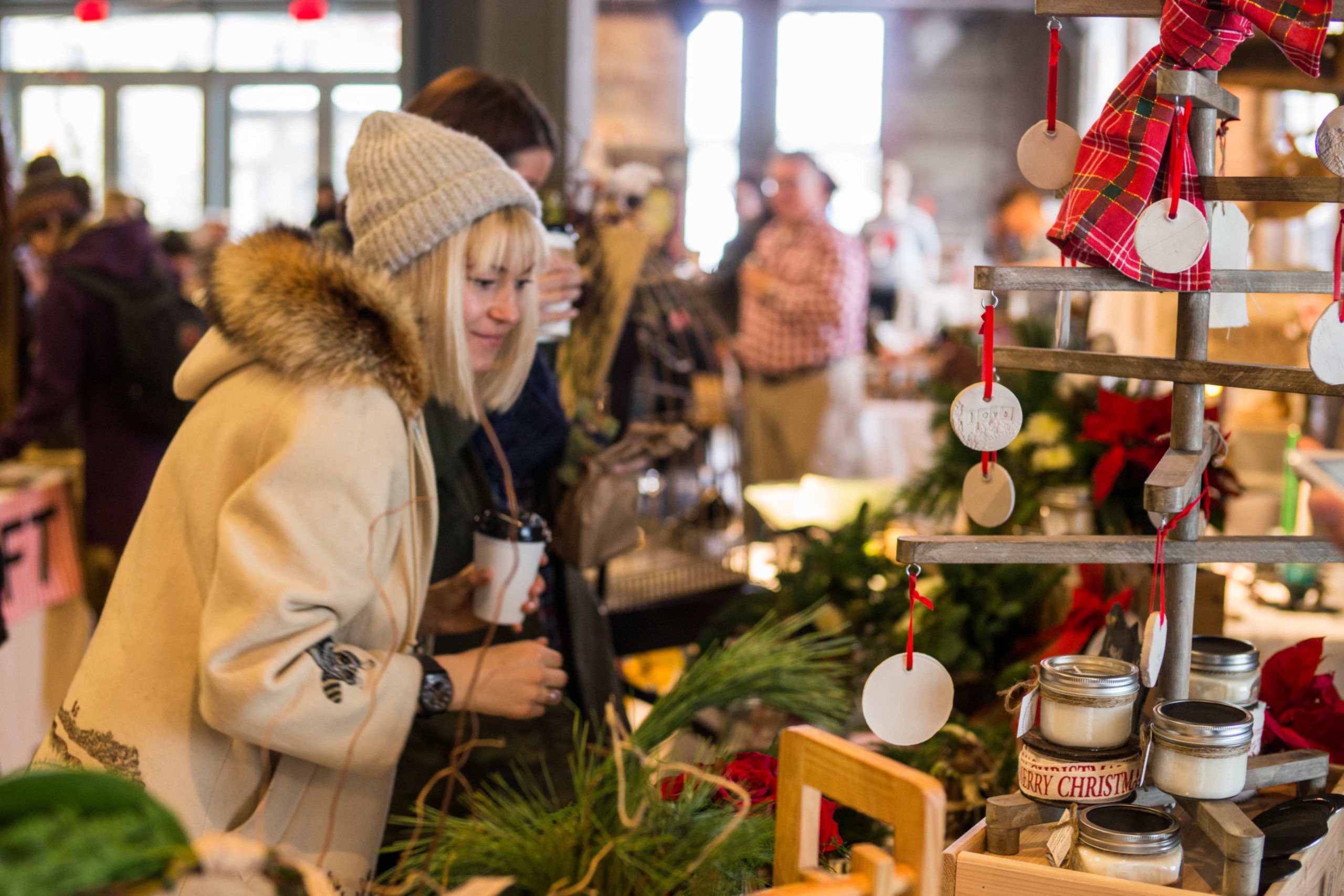 People browse local handmade goods at the Evergreen Garden Market