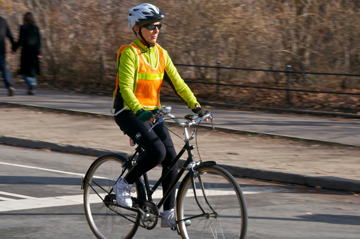 person on bike wearing bright reflective clothing