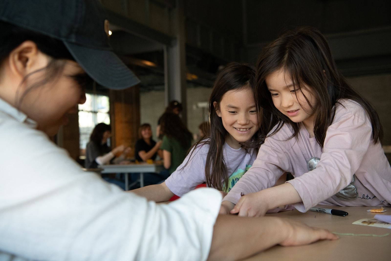 Two kids working on something together