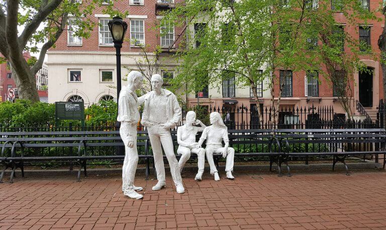 Gay Liberation Monument at Christopher Park, New York City. White statues in public square.