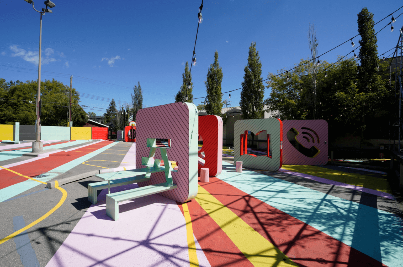 Parking lot with colourful seating and statues